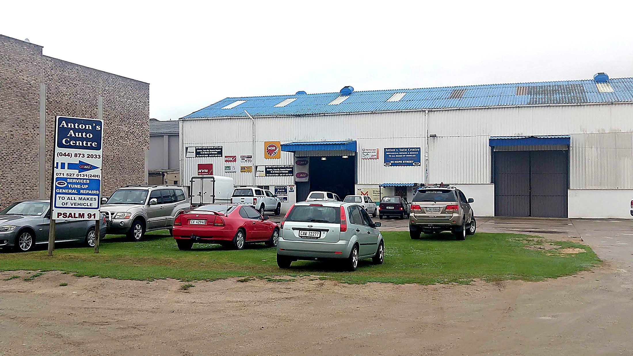 Anton's Auto Centre workshop in George Industria, cars waiting outside the open bay